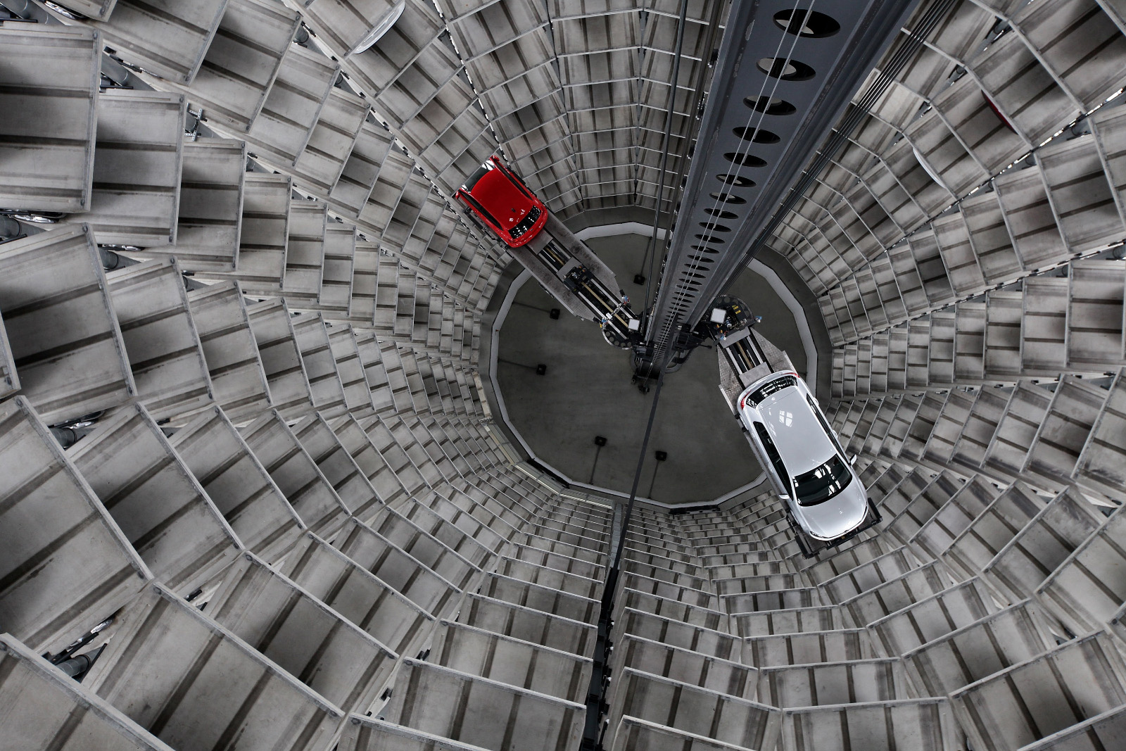 WOLFSBURG, GERMANY - MARCH 11:  Cars by German automaker Volkswagen AG are deposited into one of two storage towers at the Autostadt customer reception center at the Volkswagen factory on the day of VW's annual press conference on March 11, 2010 in Wolfsburg, Germany. VW Chairman Martin Winterkorn admitted that VW had been affected by the worldwide financial crisis in 2009, though reported that many of VW's brands reported growth, especially in China. VW customers who come to Wolfsburg to pick up their car in person receive their new car after a robot extracts the car from one of the two towers and brings it to them via an automated, underground transport system. Each of the two towers hold 400 cars.  (Photo by Sean Gallup/Getty Images)